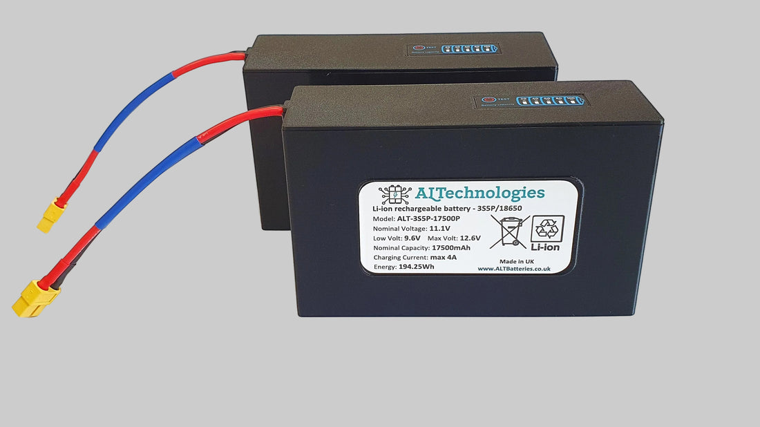 Pair of Toslon X-Boat-compatible 11.1V 17.5Ah lithium batteries showing specification label and XT60 leads
