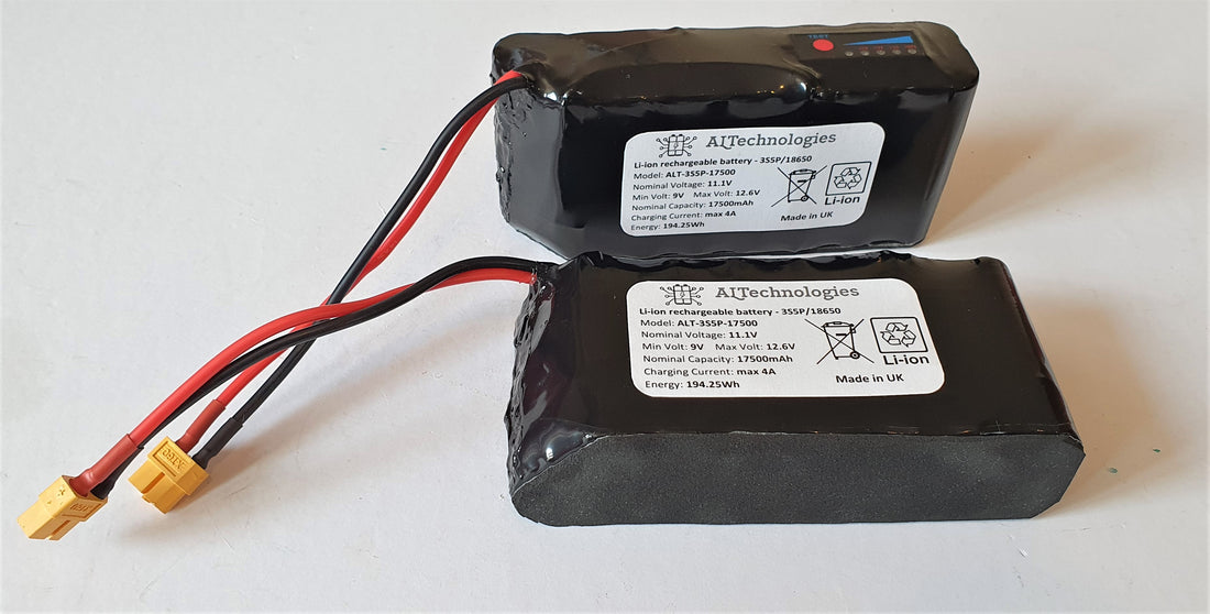 Angled view of two 11.1V 17.5Ah Toslon X-Boat lithium batteries showing labels and XT60 leads